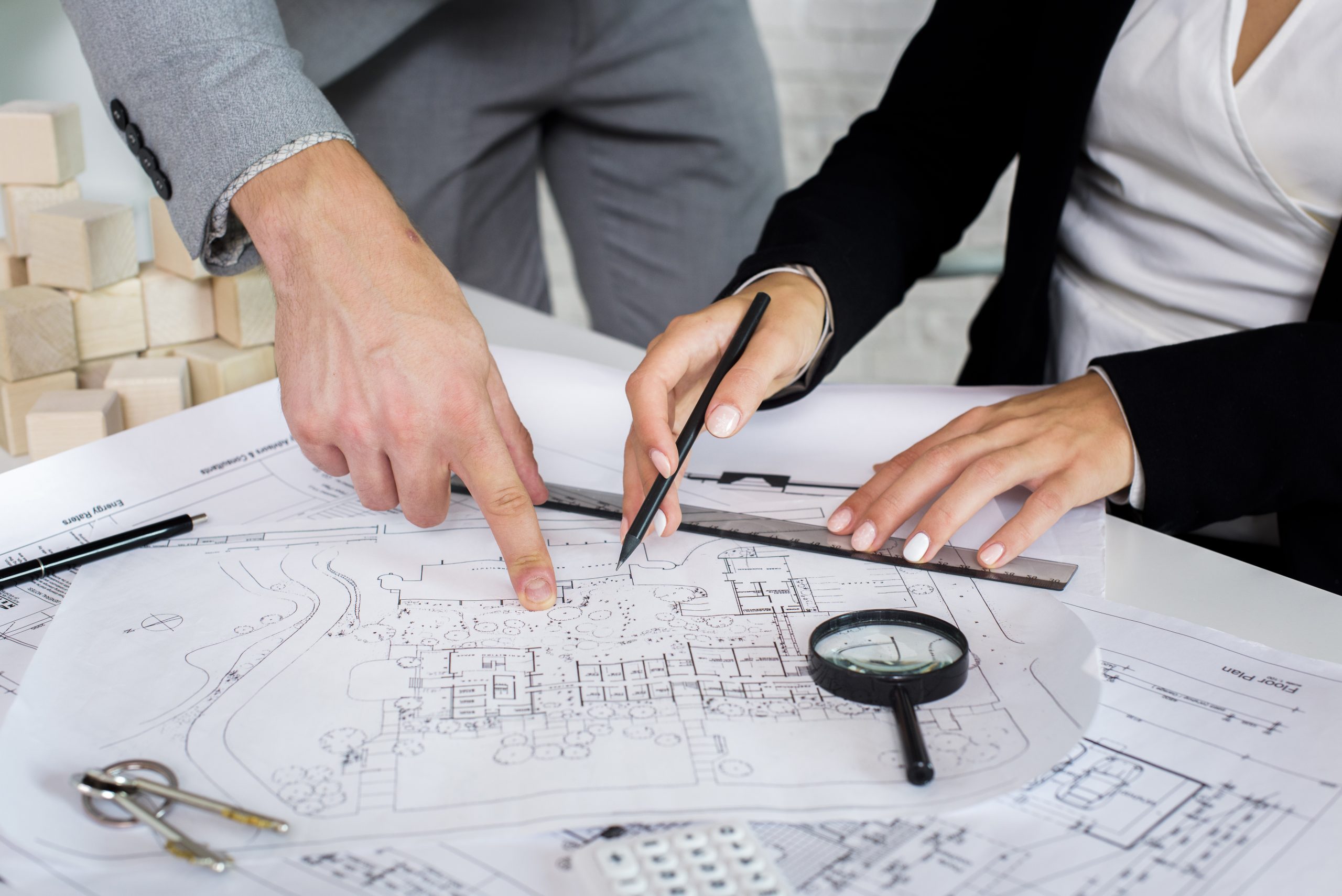 team-members-analyzing-architectural-plan
